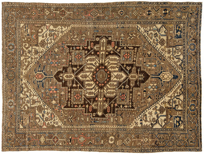 An antique Persian-style wool rug with a central medallion, featuring a warm brown, beige, and navy blue color palette with intricate geometric and floral patterns.