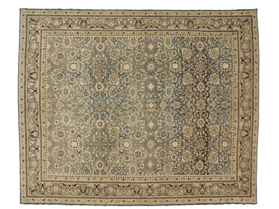 A rectangular antique malayer-style area rug with an intricate floral and medallion pattern, featuring a muted blue-gray center field, beige and cream borders, and dark brown accents.