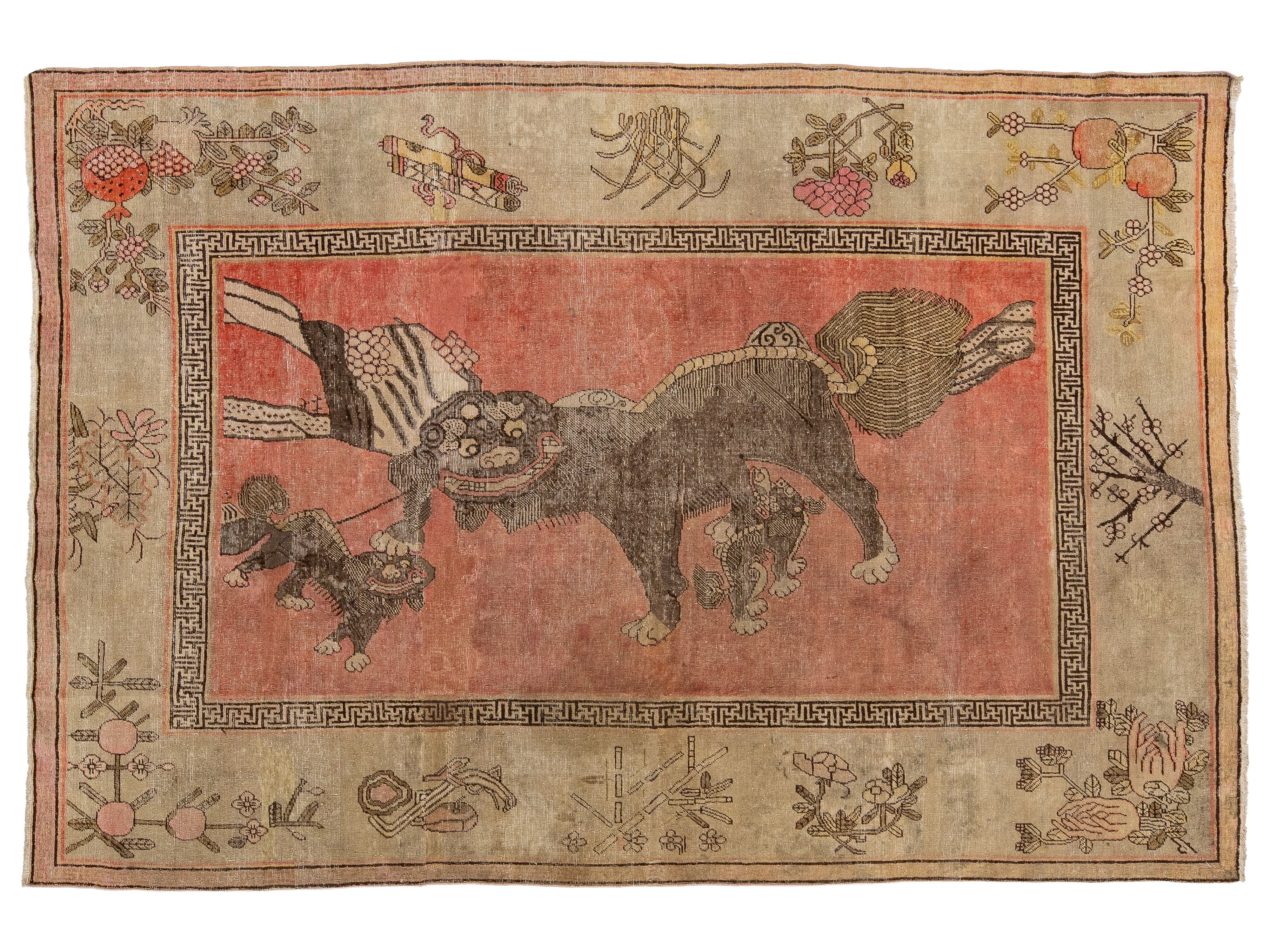 An antique Samarkand-style rug featuring a central reddish-pink panel with a dark brown animal motif, surrounded by a beige border with floral and geometric patterns.
