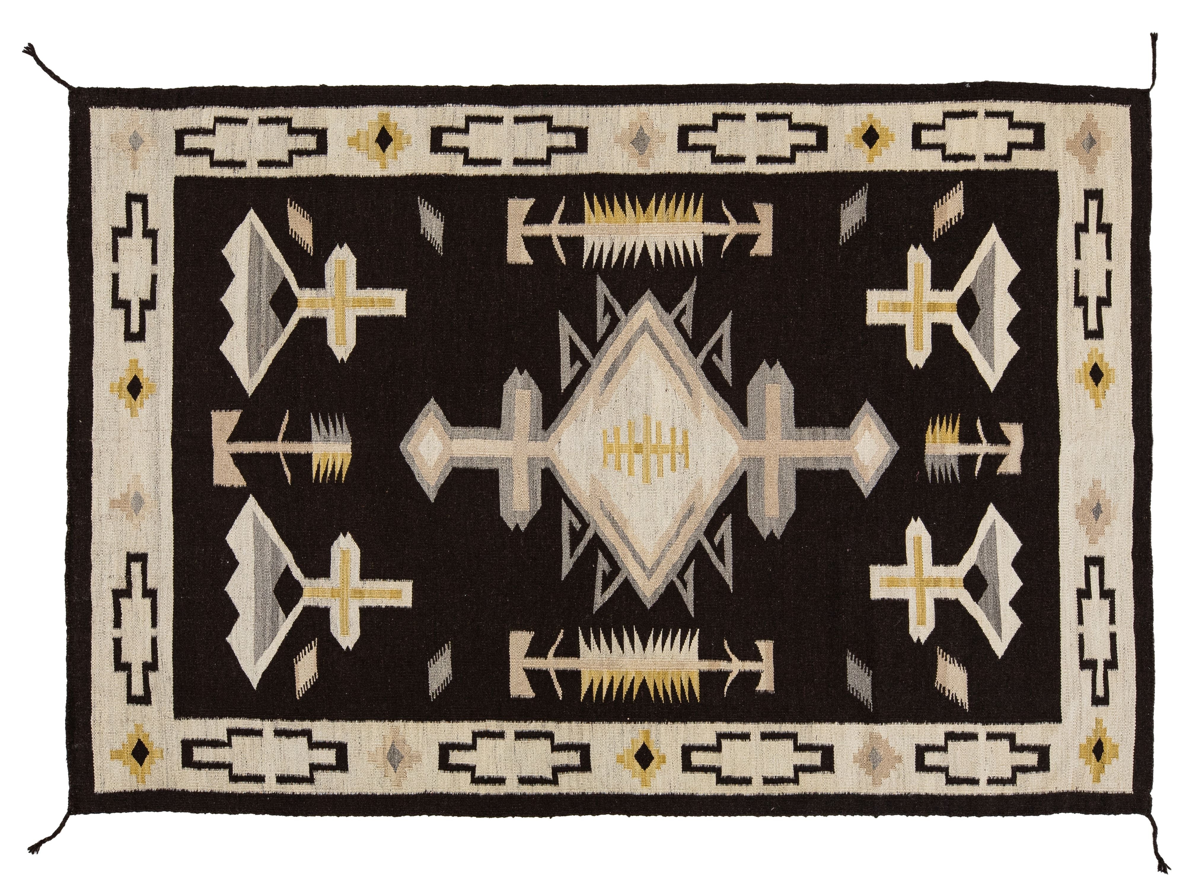 A Southwestern-style woven rug with a black central field, cream and beige geometric motifs, and yellow accents, bordered by a cream outer edge with black and yellow details.
