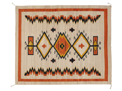A rectangular woven rug with a Southwestern geometric pattern, featuring orange, black, yellow, and cream colors on a natural beige background.