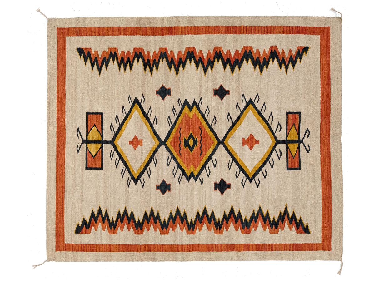 A rectangular woven rug with a Southwestern geometric pattern, featuring orange, black, yellow, and cream colors on a natural beige background.