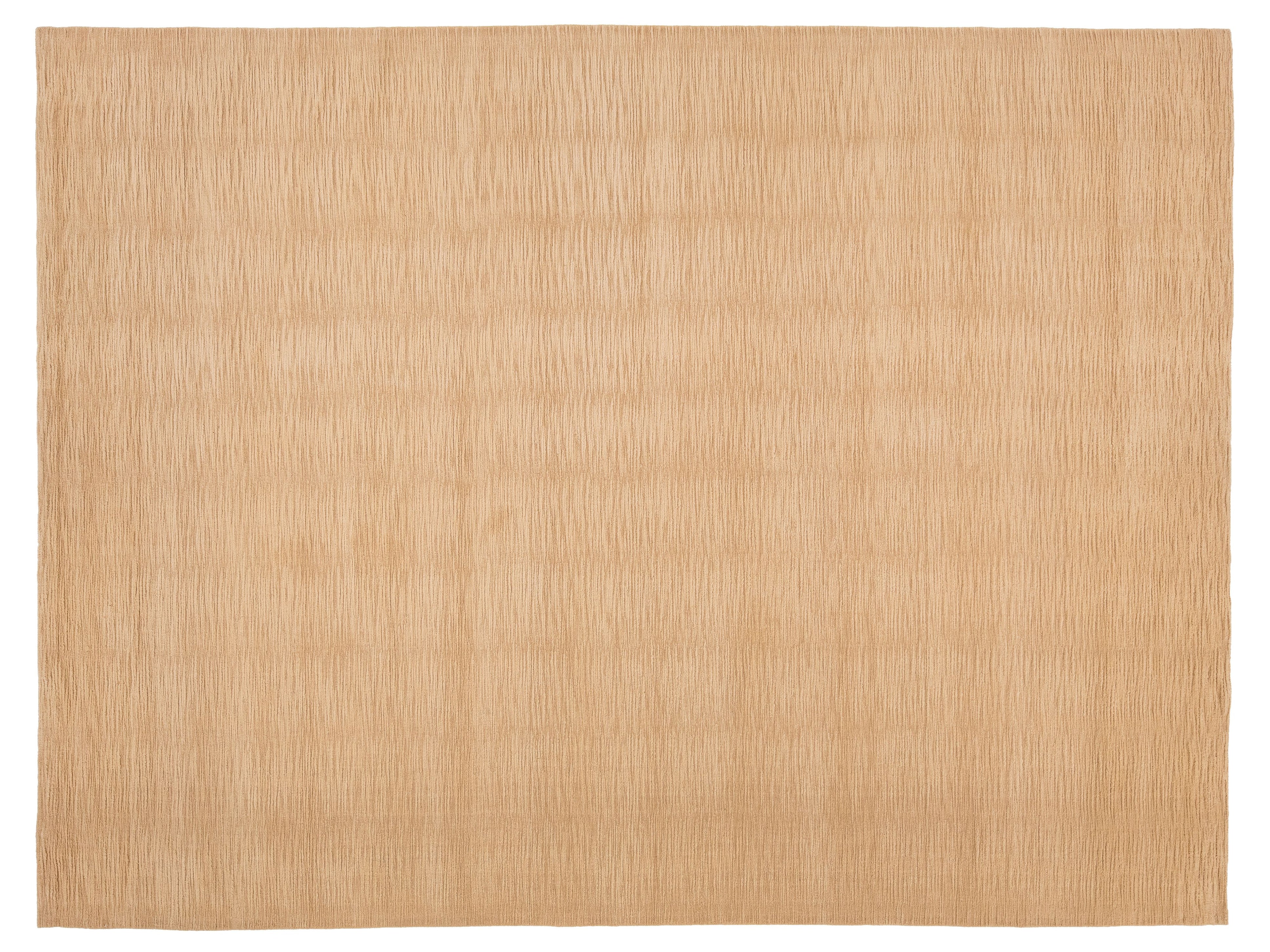 A rectangular beige woven rug with a subtle vertical textured pattern.