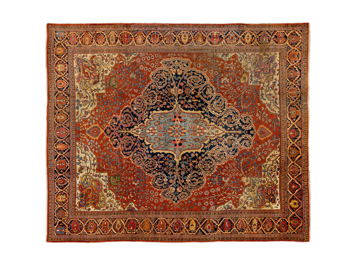 A traditional Persian Sarouk-style area rug with a complex floral and geometric pattern, featuring a central medallion in shades of red, blue, beige, and brown.