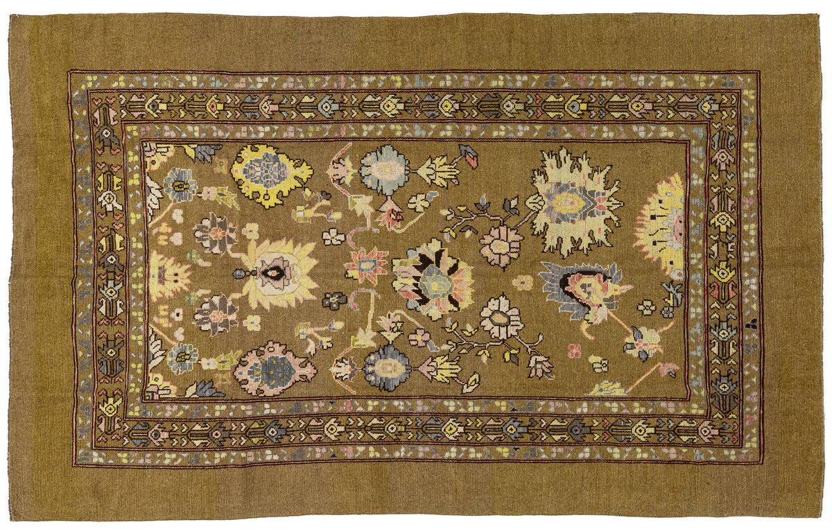 A rectangular vintage Persian rug with a warm brown field, intricate floral motifs, and a decorative border, shown flat against a white background.
