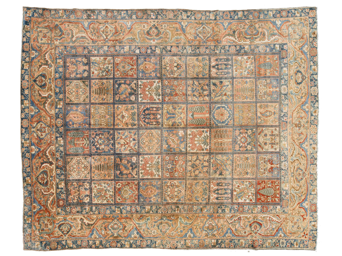 An vintage area rug with a complex grid pattern, featuring a central field of 36 individual medallions surrounded by a wide ornate border. The color palette is dominated by warm beige, dusty blue, rust red, and dark brown.