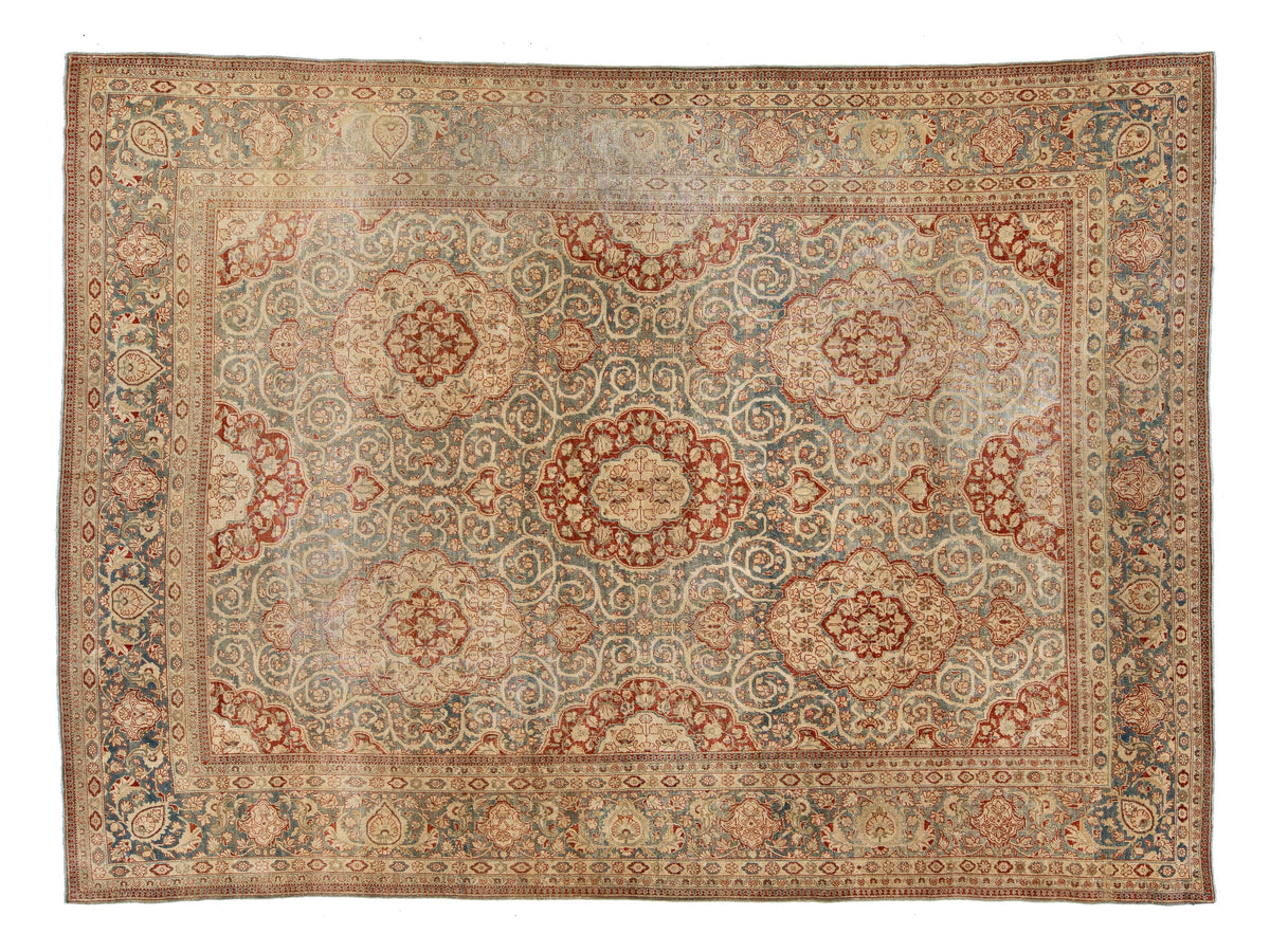 A traditional Oushak style area rug with an intricate floral and medallion pattern in muted tones of beige, rust red, dusty blue, and cream.