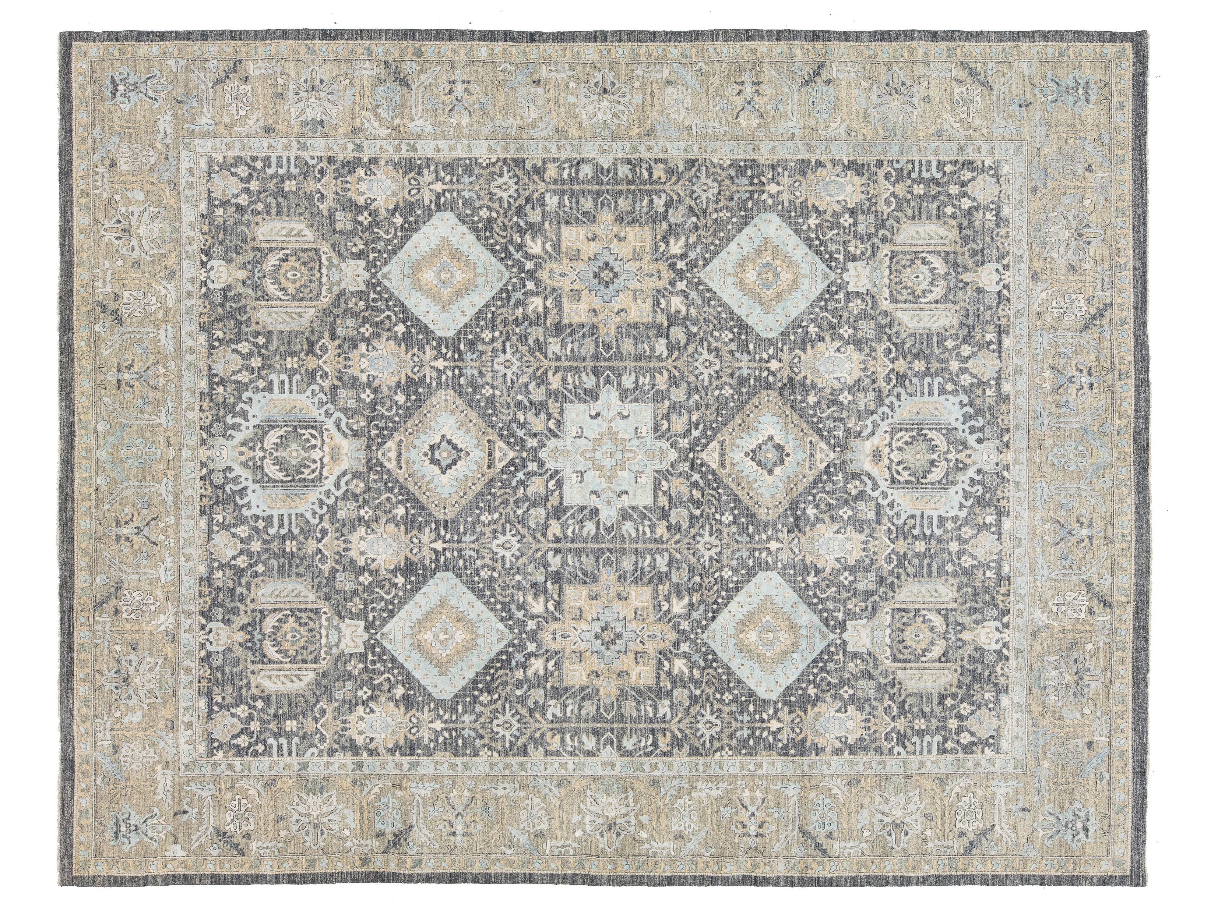 A rectangular area rug with a traditional medallion pattern in muted gray, beige, and light blue tones, shown flat against a white background.