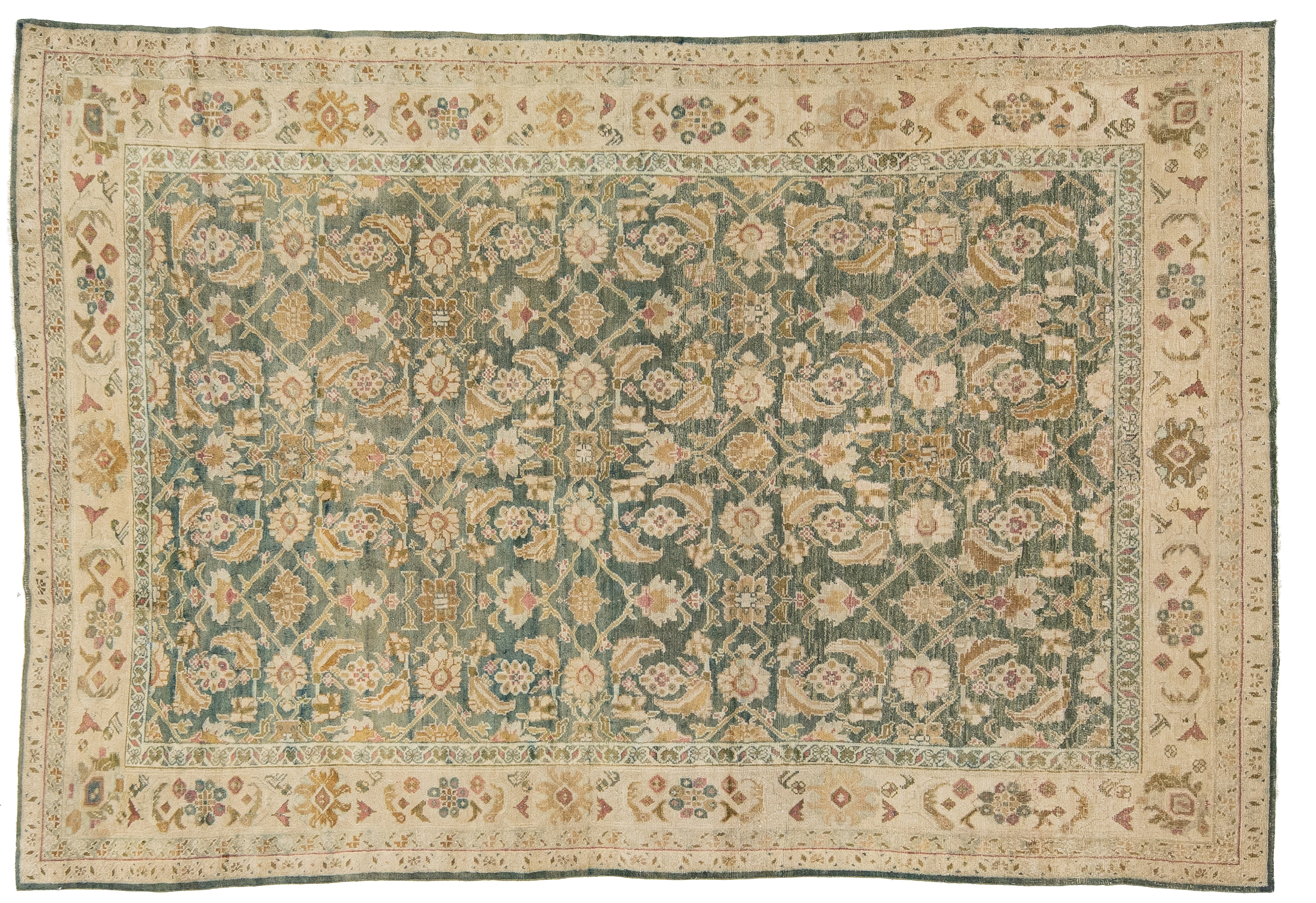 An antique oriental Agra rug with a teal-green center field, beige borders, and cream floral motifs.