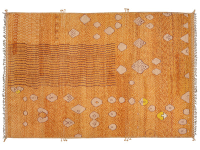 A rectangular orange-brown woven rug with beige geometric motifs, horizontal wavy lines, and small yellow accents, shown flat against a white background.