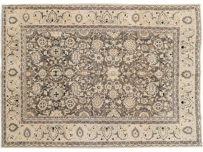 A vintage persian malayer-style area rug with an intricate floral and geometric pattern in beige, taupe, gray, and muted blue tones.