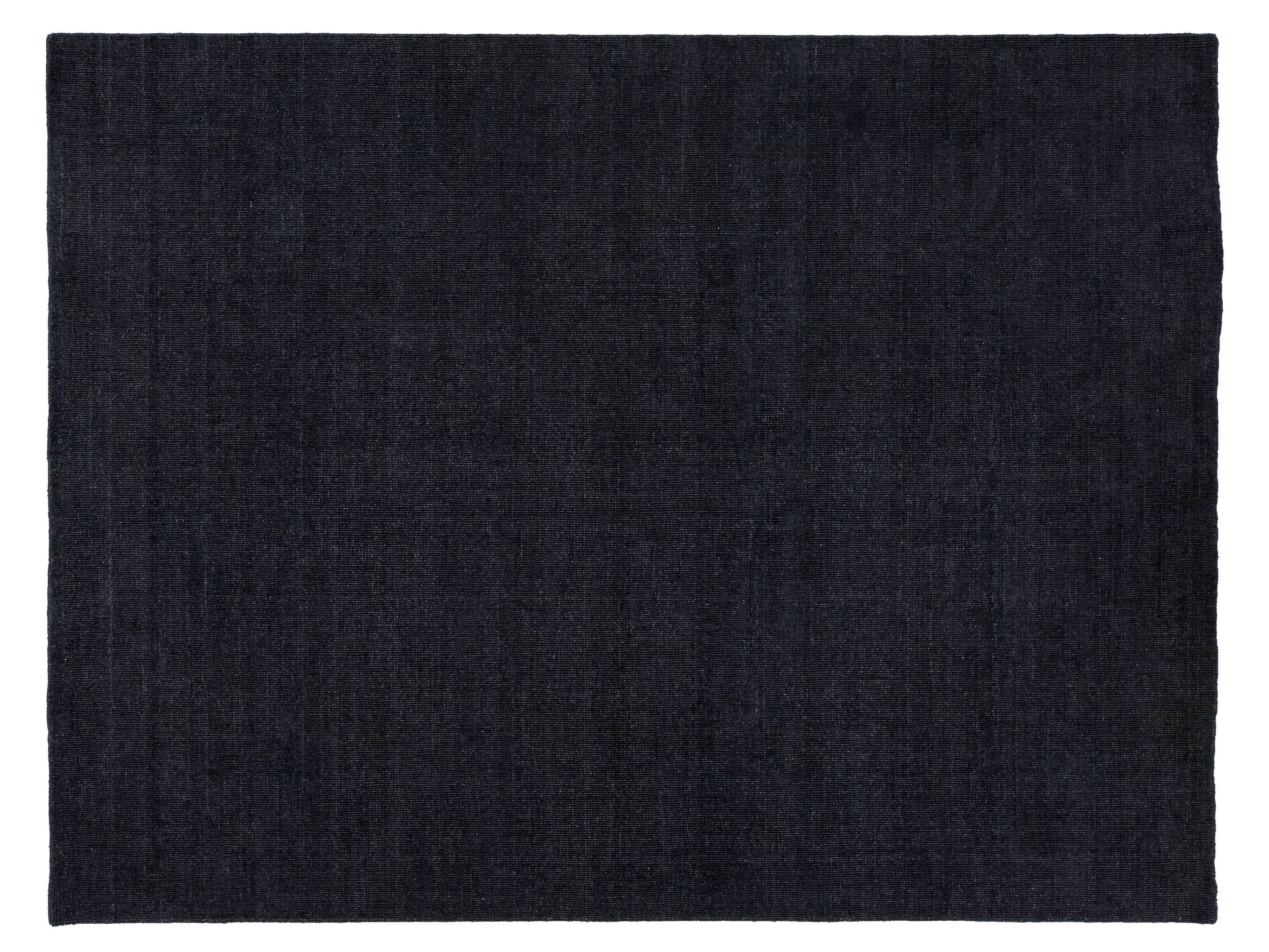A dark charcoal gray textured rug shown from a top-down view, filling almost the entire frame with a thin white border.