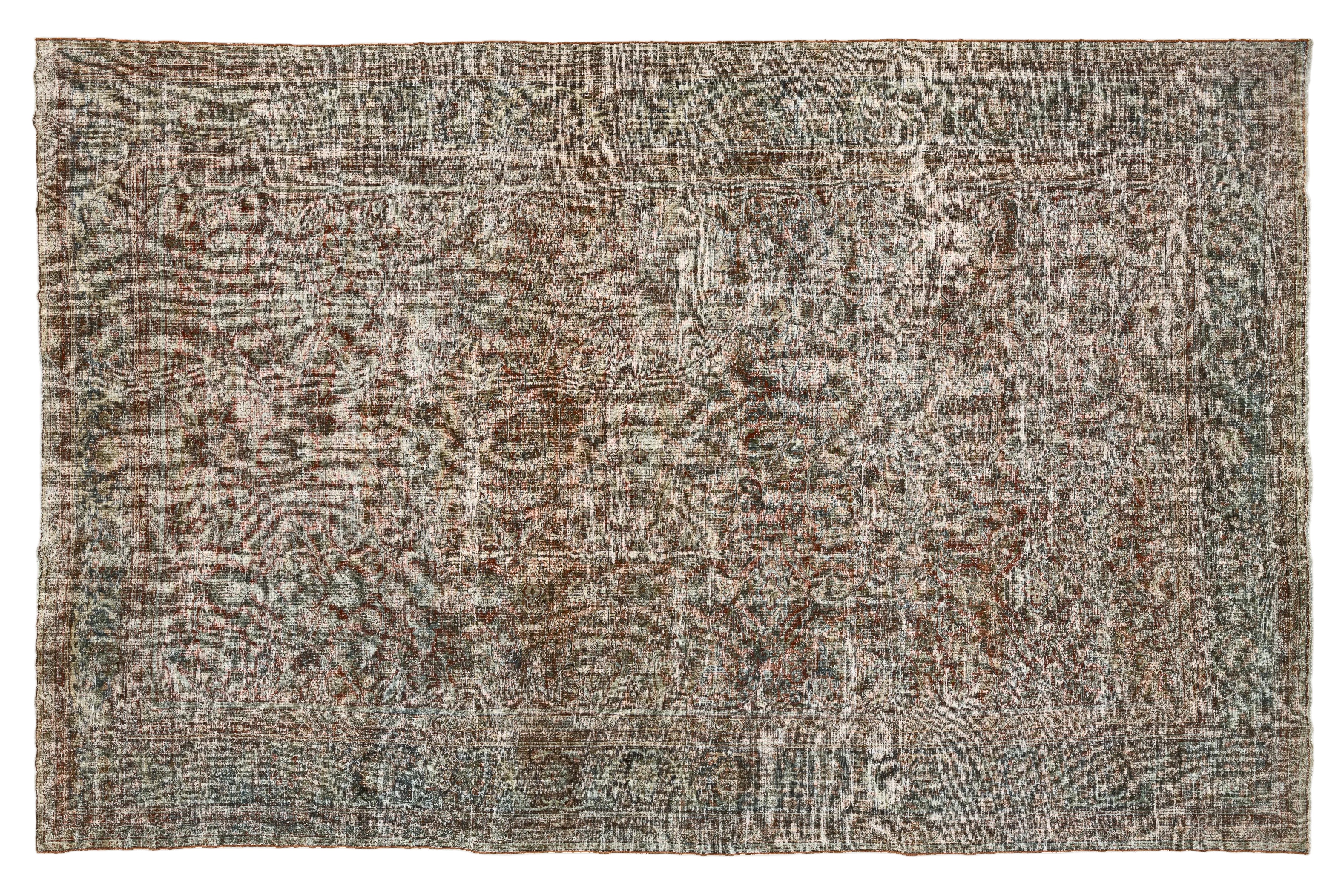 An antique-style distressed oriental rug with a faded traditional pattern in muted tones of brown, beige, gray, and blue, shown flat against a white background.