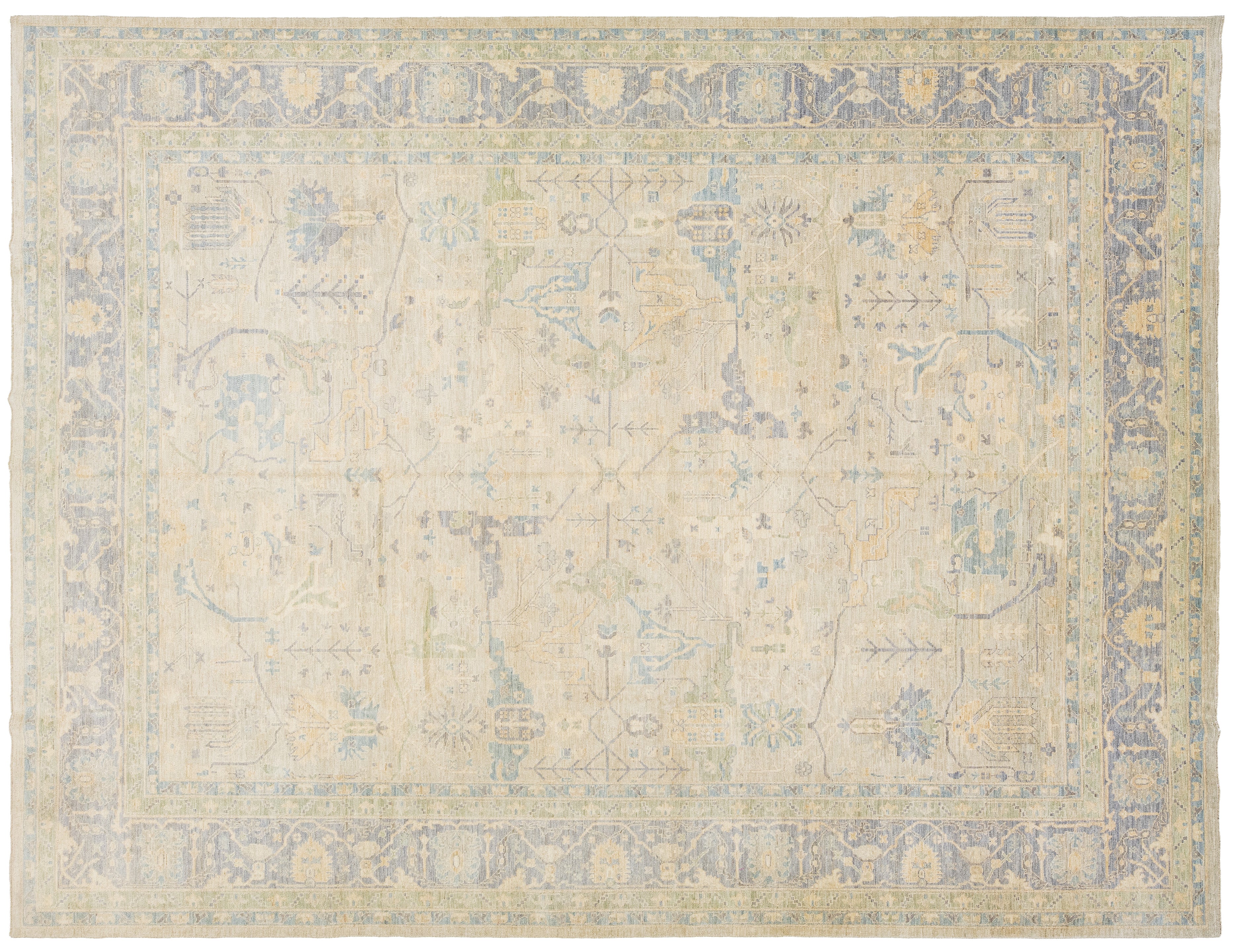 An oushak-style rectangular area rug with a floral pattern in muted beige, light blue, and soft yellow tones.