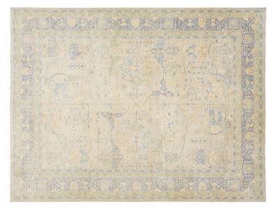 An oushak-style rectangular area rug with a floral pattern in muted beige, light blue, and soft yellow tones.