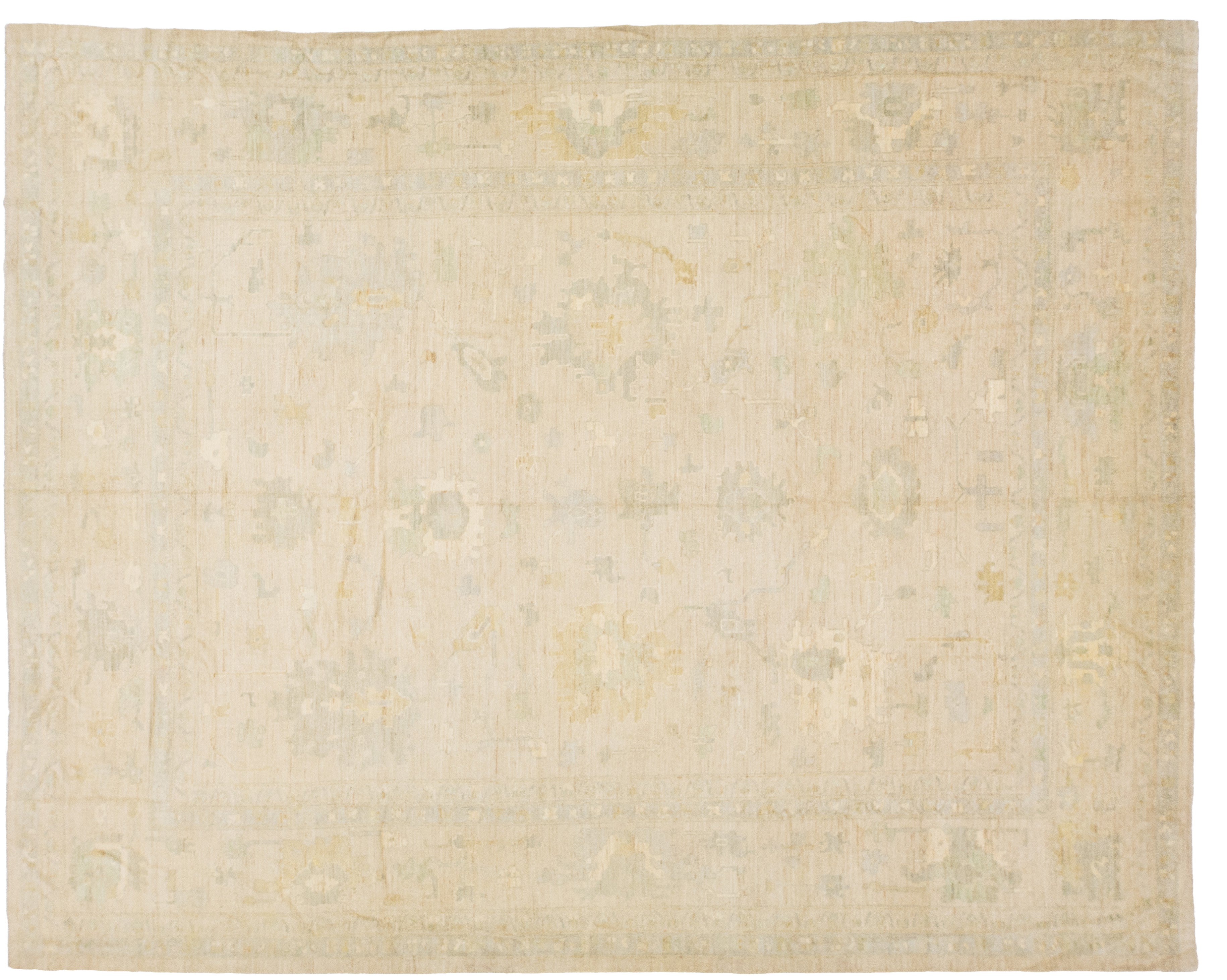 A rectangular area rug with a faded, traditional pattern in soft beige, cream, and muted sage green tones.