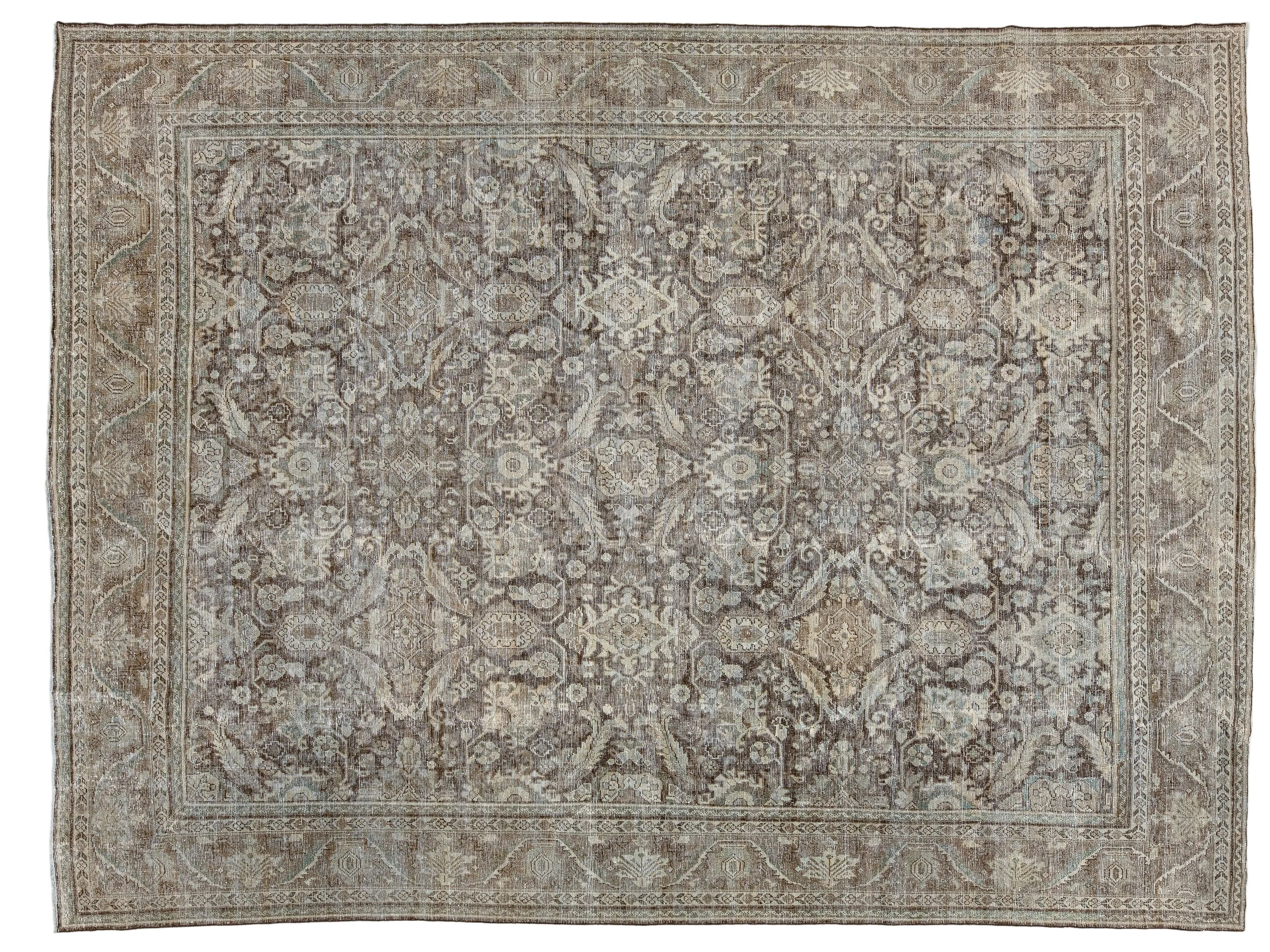 A square vintage-style area rug with an intricate floral and medallion pattern in muted gray, beige, and brown tones, photographed flat against a white background.