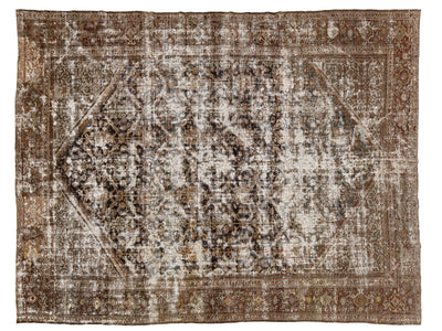 A distressed vintage-style area rug with an intricate traditional pattern in shades of brown, beige, and off-white, featuring a faded central medallion and ornate borders.