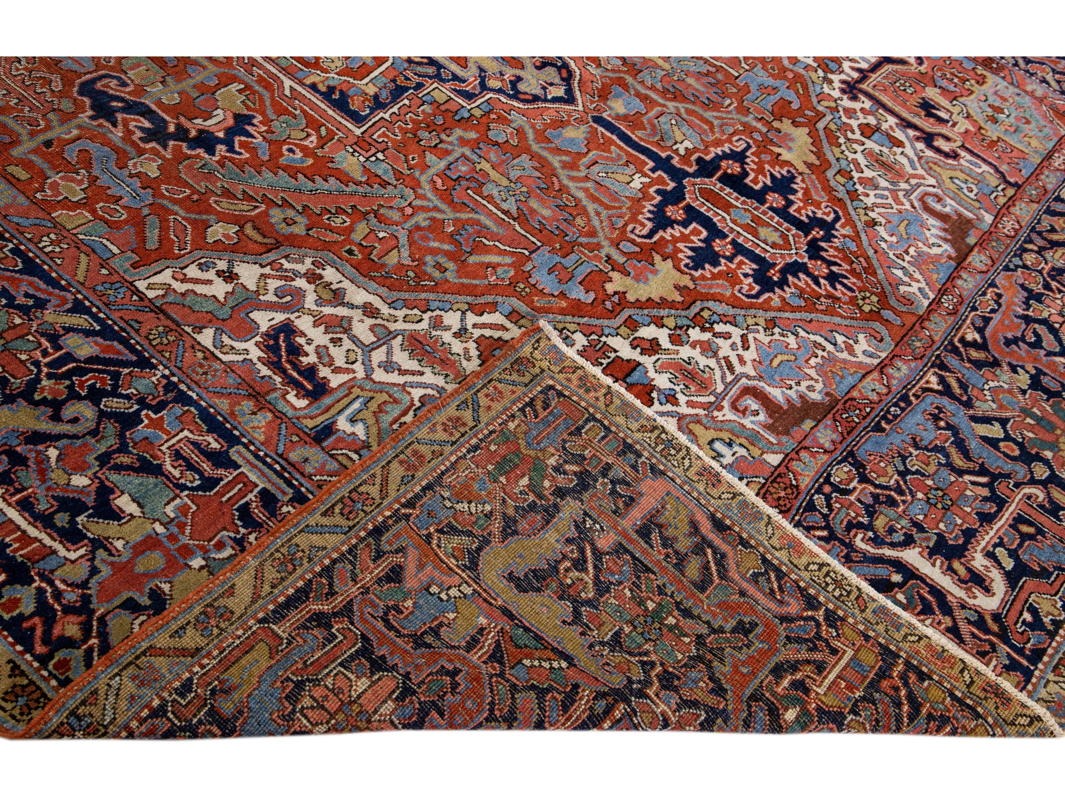 Antique Persian Heriz Handmade Rust Wool Rug with Medallion Design